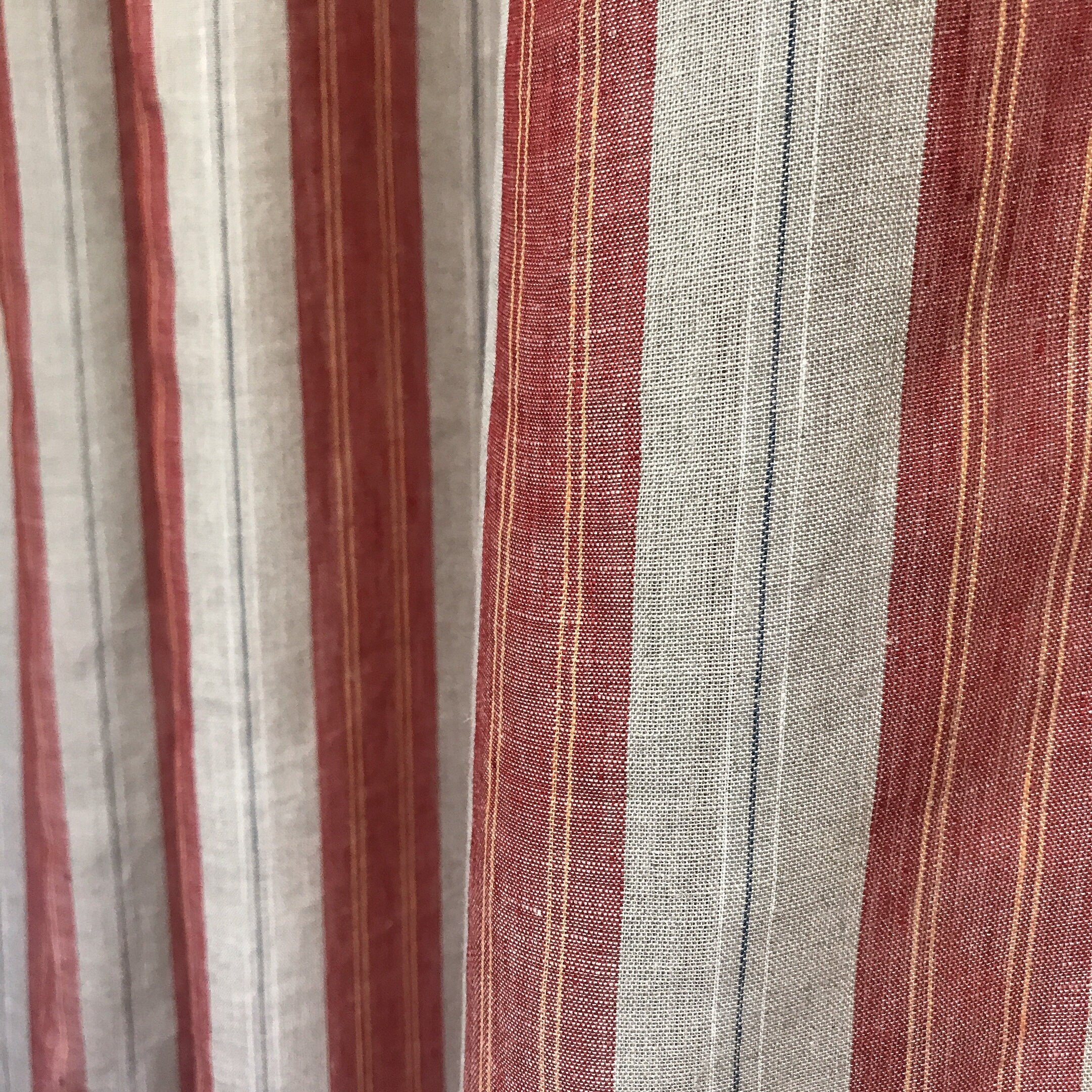 Red and Yellow Vertical Stripe Linen Curtain on Natural Beige with Orange Accents