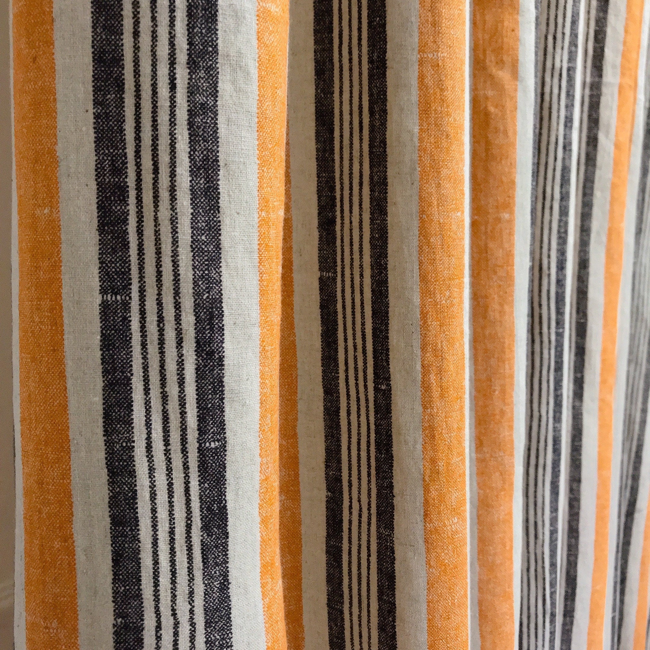 Dusty Orange and Black Stripe Curtain on Natural Beige