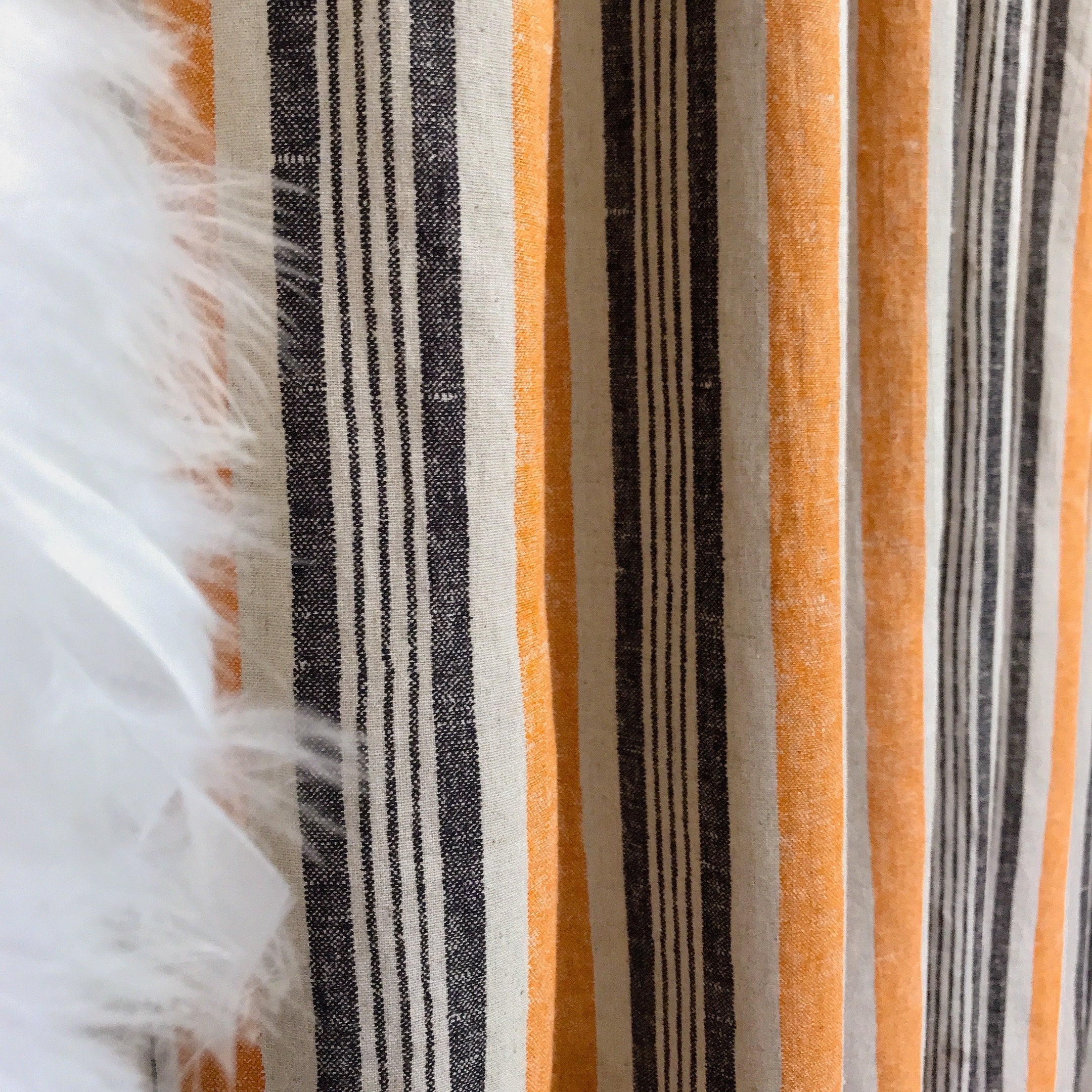 Dusty Orange and Black Stripe Curtain on Natural Beige