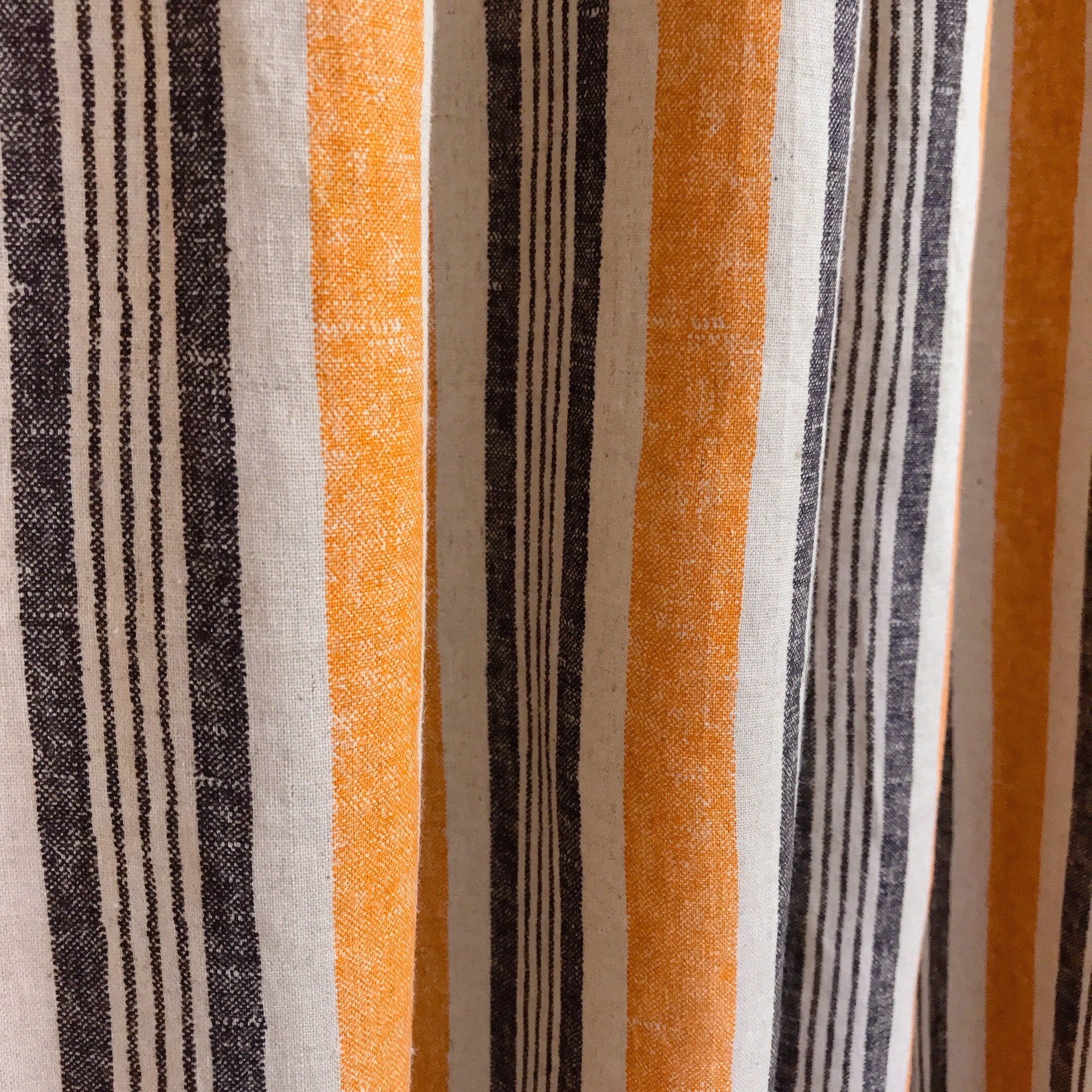 Dusty Orange and Black Stripe Curtain on Natural Beige