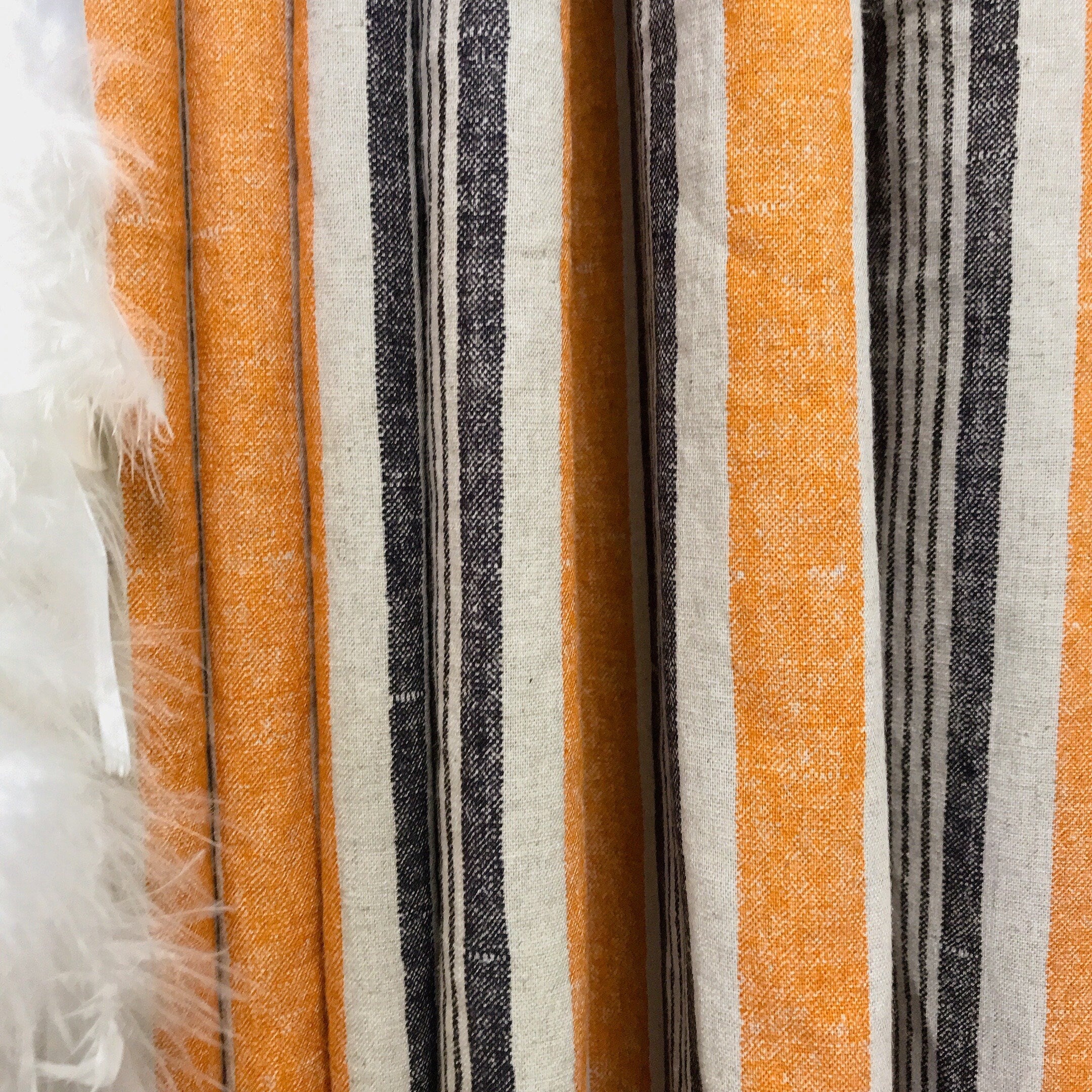 Dusty Orange and Black Stripe Curtain on Natural Beige