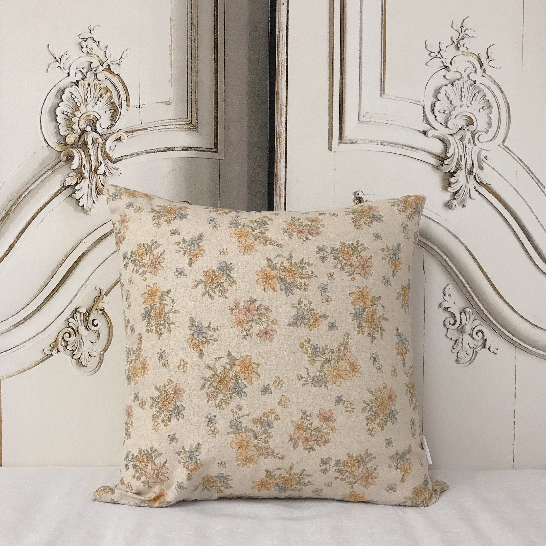 Pale Orange and Light Pink Floral Cushion Cover on Natural Beige