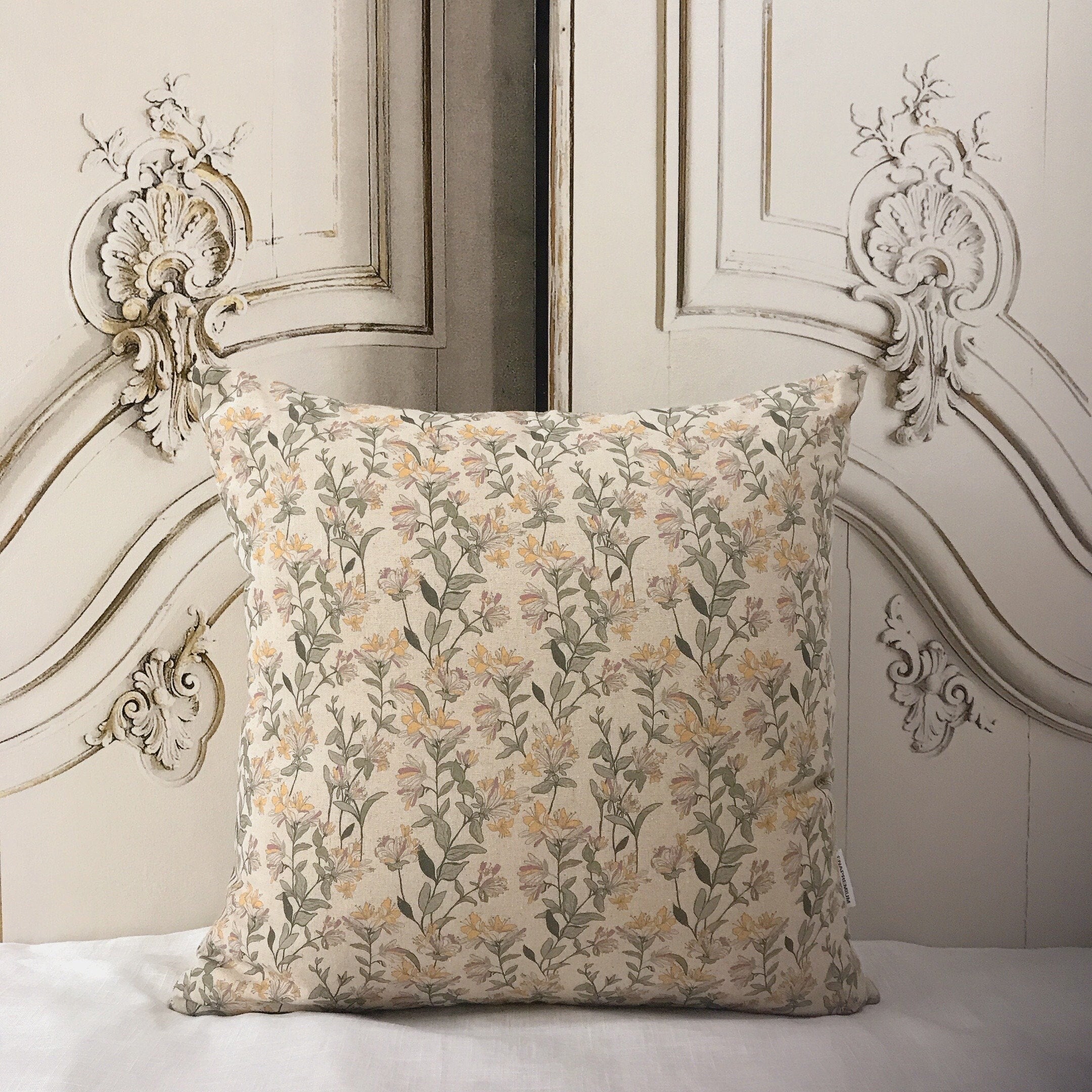 Light Orange and Plum Pink Floral Cushion Cover on Natural Beige