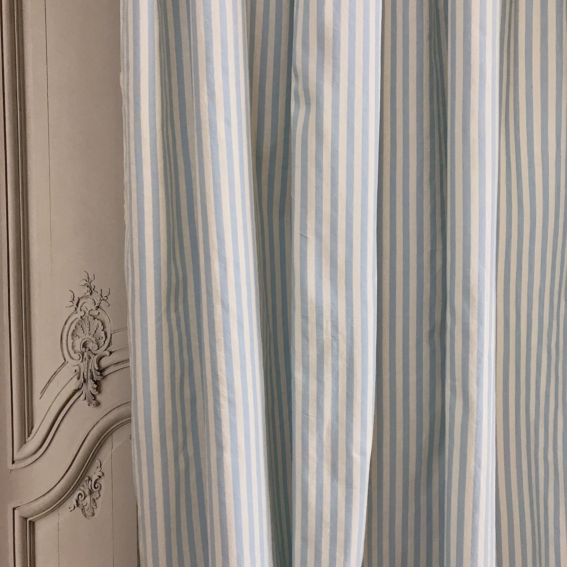 Faded Light Blue Striped Curtain on Ivory