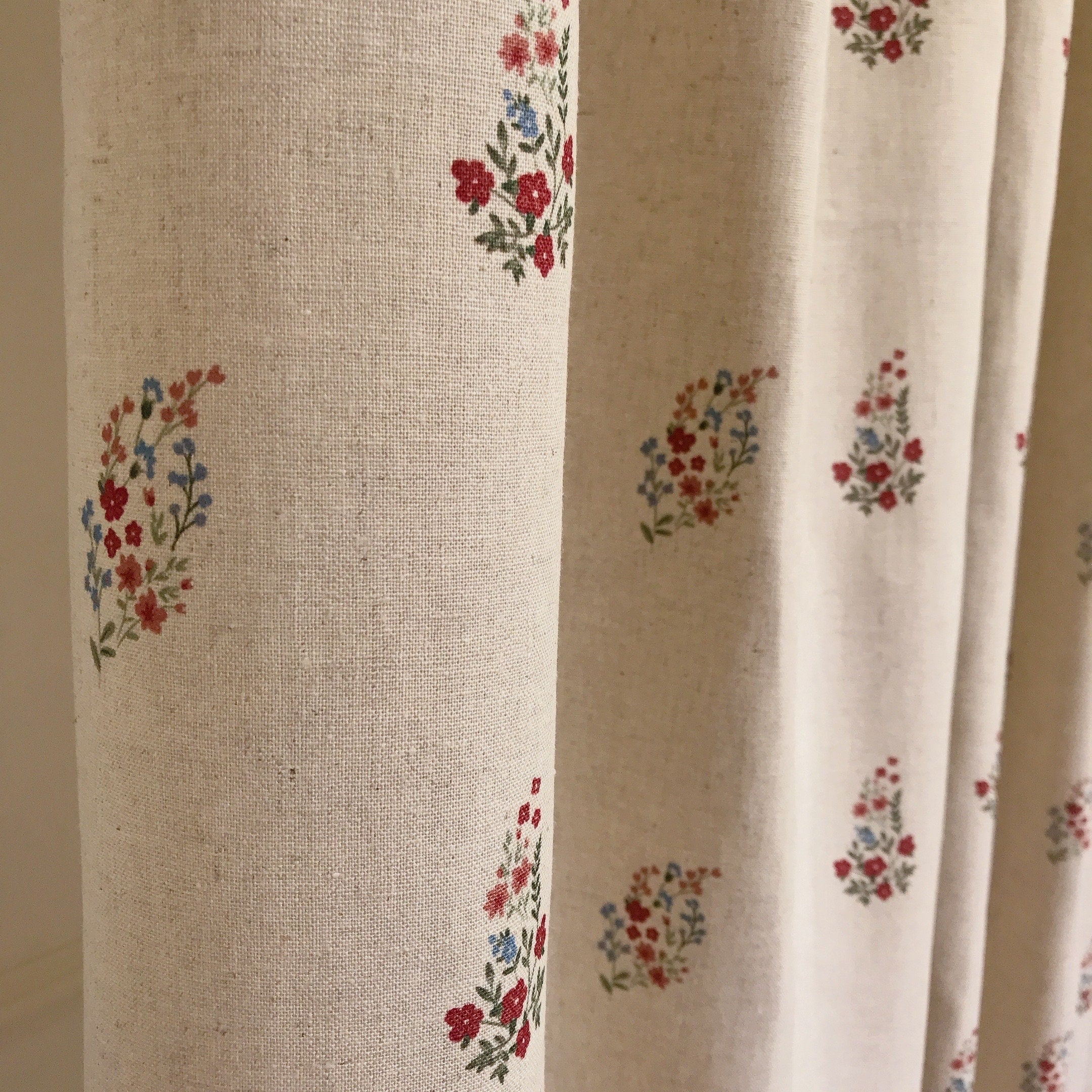 Red and Raspberry Pink Floral Curtain on Natural Beige