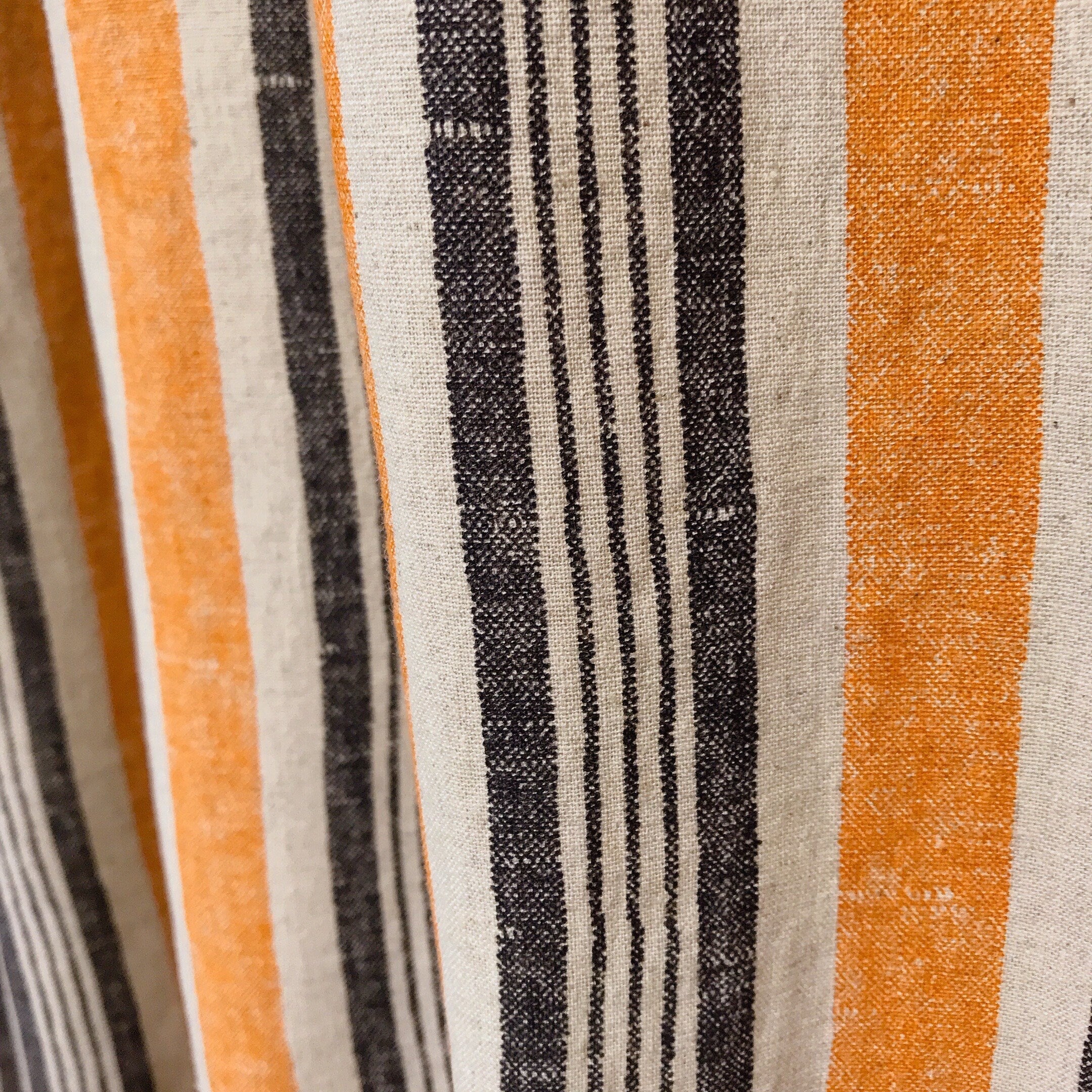 Dusty Orange and Black Stripe Curtain on Natural Beige